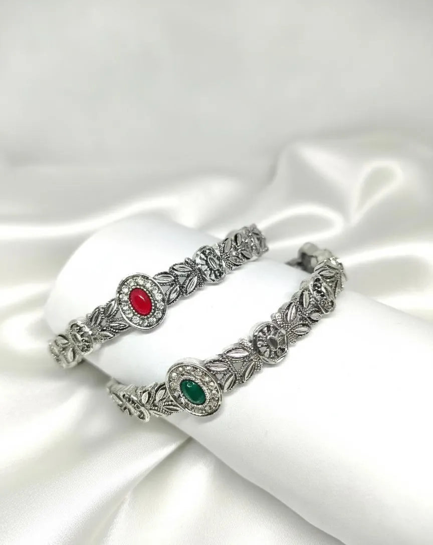 Elegant Silver Floral Design Bangles – 2 Pcs Antique-Style Kada Set for Women | Red & Green Stone Bracelet Bangles
