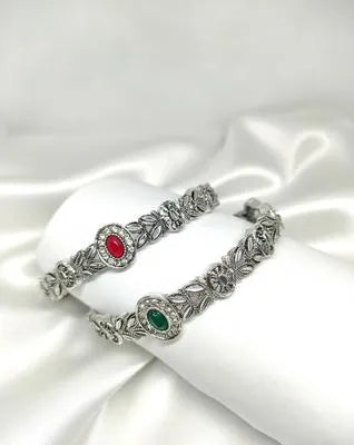 Elegant Silver Floral Design Bangles – 2 Pcs Antique-Style Kada Set for Women | Red & Green Stone Bracelet Bangles
